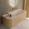 MONDIAZ KURVE-DLUX Meuble de salle de bains 115cm arrondi à gauche couleur Chêne avec 1 tiroir et 1 porte. Lavabo BIG SMALL à droite sans trou de robinet Nata. SW1432076