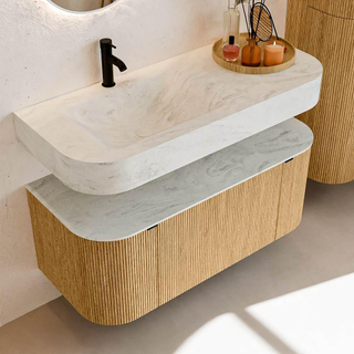 MONDIAZ THOR-DLUX 110cm badmeubel ronding links + rechts kleur Oak met 1 lade en 2 deuren. Vrijhangende wastafel CLOUD Links 1 kraangat kleur Opalo.