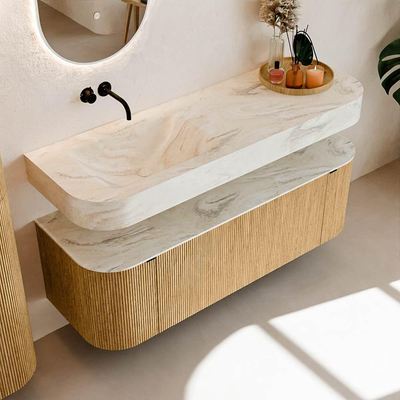 MONDIAZ THOR-DLUX 140cm badmeubel ronding links + rechts kleur Oak met 1 lade en 2 deuren. Vrijhangende wastafel CLOUD Links zonder kraangat kleur Ostra.