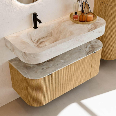 MONDIAZ THOR-DLUX 110cm badmeubel ronding links + rechts kleur Oak met 1 lade en 2 deuren. Vrijhangende wastafel CLOUD Links 1 kraangat kleur Frappe.