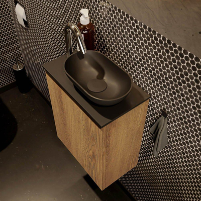 Mondiaz Fowy meuble de toilette - 40x50x23cm - chêne blanchi mat - 1 trou de robinet - lavabo à droite - 1 porte - solid surface - plan Mélamine - lavabo : noir