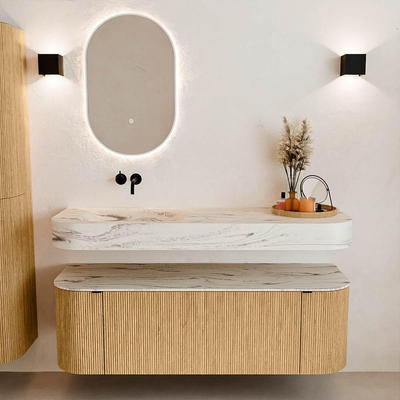 MONDIAZ THOR-DLUX 140cm badmeubel ronding links + rechts kleur Oak met 1 lade en 2 deuren. Vrijhangende wastafel CLOUD Links zonder kraangat kleur Nata.