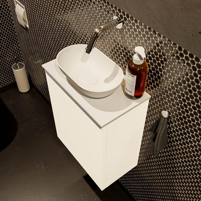 Mondiaz Fowy Toiletmeubel - 40x50x23cm - talc mat - 0 kraangaten - wasbak midden - 1 deur - solid surface - blad MDF - wasbak: wit