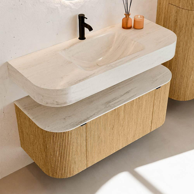 MONDIAZ THOR-DLUX 110cm badmeubel ronding links + rechts kleur Oak met 1 lade en 2 deuren. Vrijhangende wastafel CLOUD Midden 1 kraangat kleur Meli.