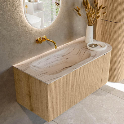 MONDIAZ KURVE-DLUX Meuble de salle de bains 105cm arrondi à droite couleur Oak avec 1 tiroir et 1 porte. Lavabo BIG SMALL à gauche sans trou de robinet Nata.