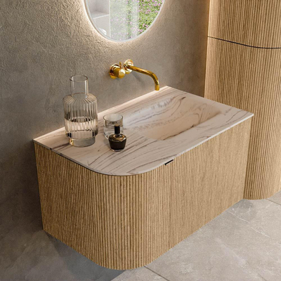 MONDIAZ KURVE-DLUX Meuble de salle de bains 75cm arrondi gauche couleur Oak avec 1 tiroir et 1 porte. Lavabo GRUNNE à droite sans trou de robinet Nata.