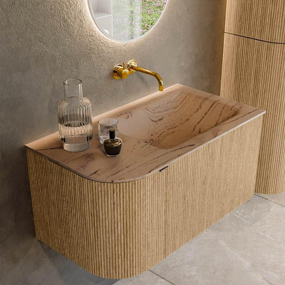MONDIAZ KURVE-DLUX Meuble de salle de bains 85cm arrondi gauche couleur Oak avec 1 tiroir et 1 porte. Lavabo CLOUD à droite sans trou de robinet Arena.