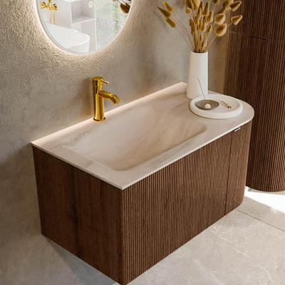 MONDIAZ KURVE-DLUX meuble de salle de bains 85cm arrondi à droite couleur Walnut avec 1 tiroir et 1 porte. Lavabo CLOUD à gauche 1 trou de robinet Meli.