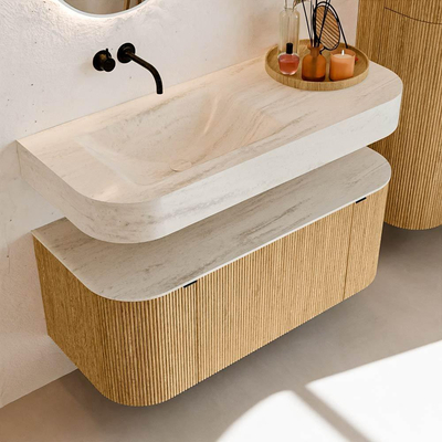 MONDIAZ THOR-DLUX 110cm badmeubel ronding links + rechts kleur Oak met 1 lade en 2 deuren. Vrijhangende wastafel CLOUD Links zonder kraangat kleur Meli.