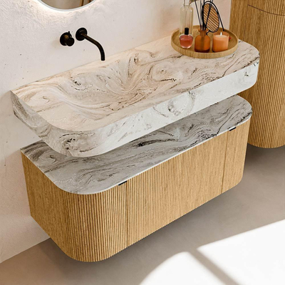 MONDIAZ THOR-DLUX 110cm badmeubel ronding links + rechts kleur Oak met 1 lade en 2 deuren. Vrijhangende wastafel CLOUD Links zonder kraangat kleur Glace.