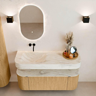 MONDIAZ THOR-DLUX 130cm badmeubel ronding links + rechts kleur Oak met 1 lade en 2 deuren. Vrijhangende wastafel CLOUD Links zonder kraangat kleur Ostra.