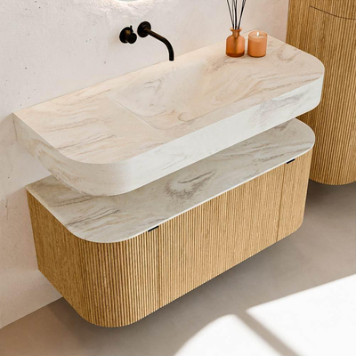 MONDIAZ THOR-DLUX 110cm badmeubel ronding links + rechts kleur Oak met 1 lade en 2 deuren. Vrijhangende wastafel CLOUD Midden zonder kraangat kleur Ostra.