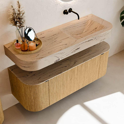 MONDIAZ THOR-DLUX 130cm badmeubel ronding links + rechts kleur Oak met 1 lade en 2 deuren. Vrijhangende wastafel CLOUD Rechts zonder kraangat kleur Arena.