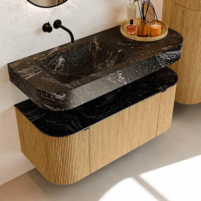 MONDIAZ THOR-DLUX 110cm badmeubel ronding links + rechts kleur Oak met 1 lade en 2 deuren. Vrijhangende wastafel CLOUD Links zonder kraangat kleur Lava.