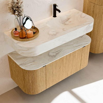 MONDIAZ THOR-DLUX 110cm badmeubel ronding links + rechts kleur Oak met 1 lade en 2 deuren. Vrijhangende wastafel CLOUD Rechts 1 kraangat kleur Ostra.