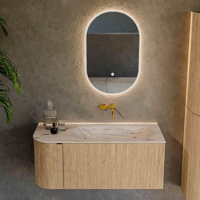 MONDIAZ KURVE-DLUX Meuble de salle de bains 105cm arrondi à gauche couleur Chêne avec 1 tiroir et 1 porte. Lavabo BIG SMALL à droite sans trou de robinet Nata.