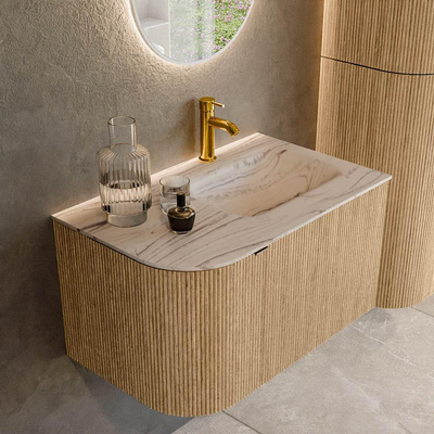 MONDIAZ KURVE-DLUX Meuble de salle de bains 75cm arrondi à gauche couleur chêne avec 1 tiroir et 1 porte. Lavabo GRUNNE à droite 1 trou de robinet Nata.