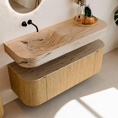 MONDIAZ THOR-DLUX 130cm badmeubel ronding links + rechts kleur Oak met 1 lade en 2 deuren. Vrijhangende wastafel CLOUD Links zonder kraangat kleur Arena.