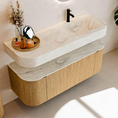 MONDIAZ THOR-DLUX 130cm badmeubel ronding links + rechts kleur Oak met 1 lade en 2 deuren. Vrijhangende wastafel CLOUD Rechts 1 kraangat kleur Ostra.