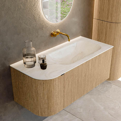 MONDIAZ KURVE-DLUX meuble de salle de bains 105 cm avec module 25 L couleur Oak avec 1 tiroir et 1 porte. Plan-vasque BIG SMALL à droite sans trou de robinetterie couleur Ostra.