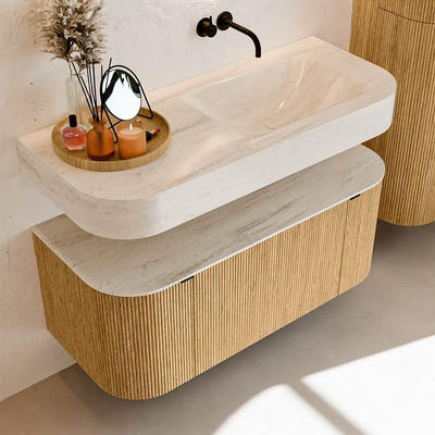 MONDIAZ THOR-DLUX 110cm badmeubel ronding links + rechts kleur Oak met 1 lade en 2 deuren. Vrijhangende wastafel CLOUD Rechts zonder kraangat kleur Meli.