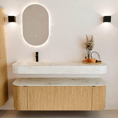 MONDIAZ THOR-DLUX 150cm badmeubel ronding links + rechts kleur Oak met 1 lade en 2 deuren. Vrijhangende wastafel CLOUD Links 1 kraangat kleur Ostra.