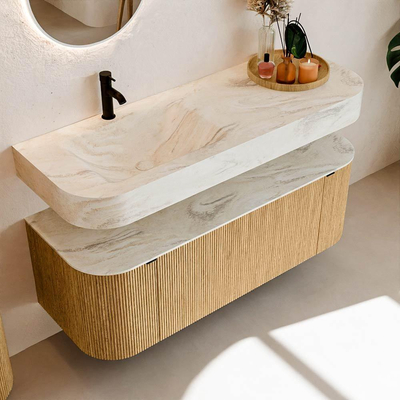 MONDIAZ THOR-DLUX 130cm badmeubel ronding links + rechts kleur Oak met 1 lade en 2 deuren. Vrijhangende wastafel CLOUD Links 1 kraangat kleur Ostra.
