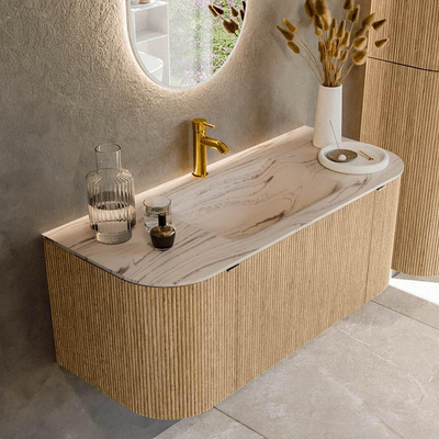 MONDIAZ KURVE-DLUX 110cm badmeubel ronding Links + Rechts kleur Oak met 1 lade en 2 deuren. Wastafel CLOUD Midden 1 kraangat Nata.