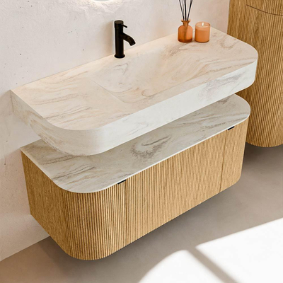MONDIAZ THOR-DLUX 110cm badmeubel ronding links + rechts kleur Oak met 1 lade en 2 deuren. Vrijhangende wastafel CLOUD Midden 1 kraangat kleur Ostra.